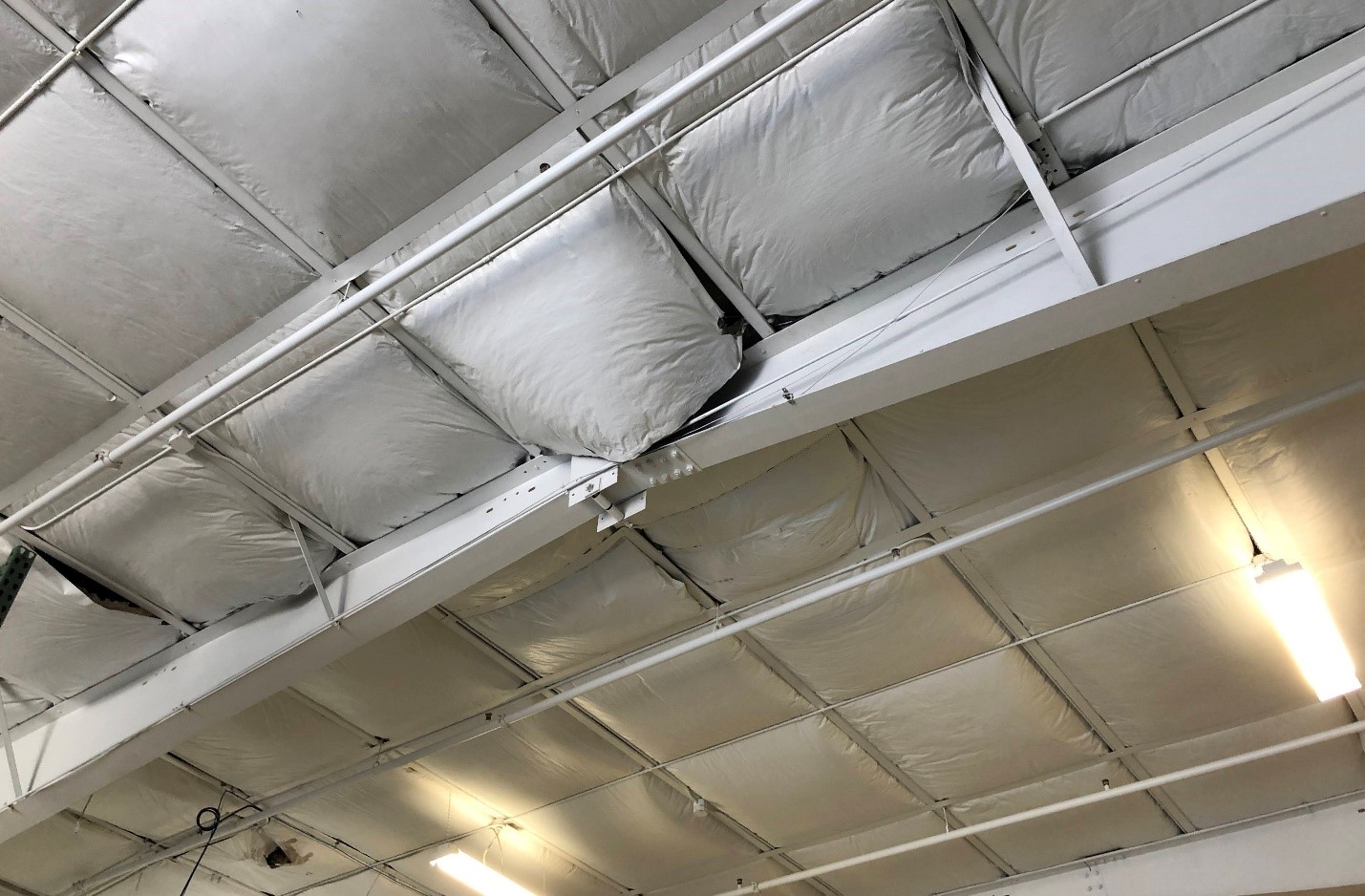 Sagging Wet Insulation from Roof Leak Wet insulation sagging from ceiling