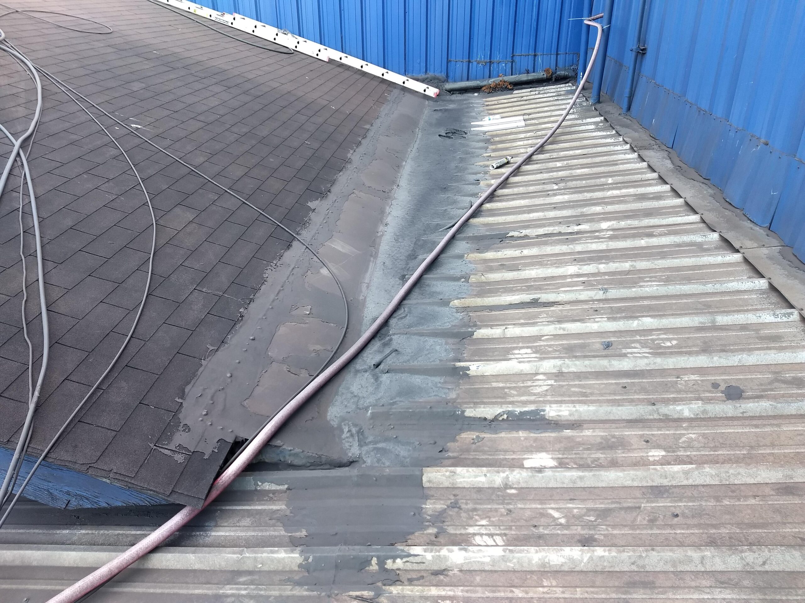Roof valley needing repair Commercial building with failing roof valley