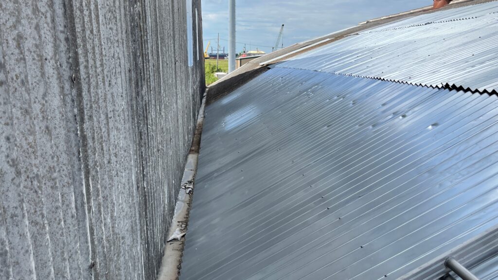 Hidden Transite Roof Panels Transite Roof Panels hidden under metal panels.