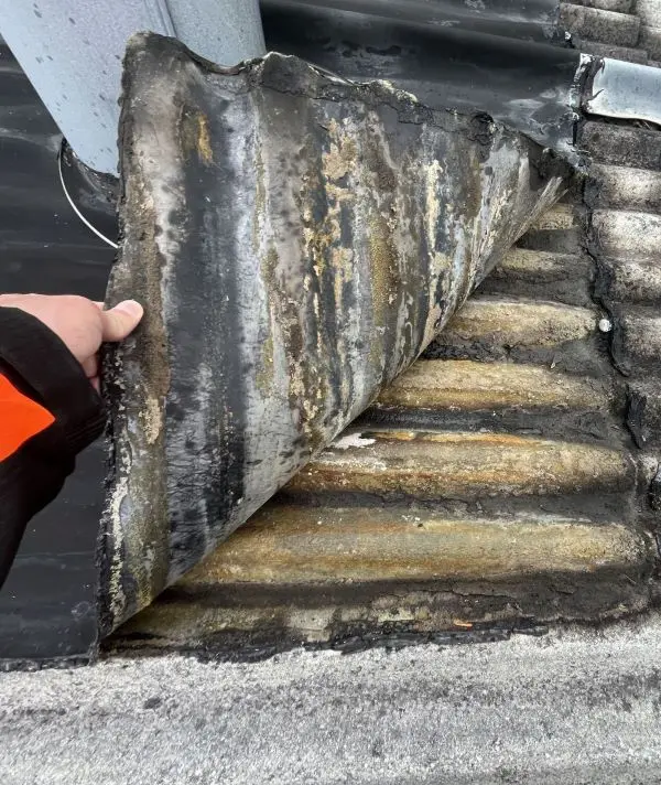 Transite roof panel with delaminated EPDM overlay