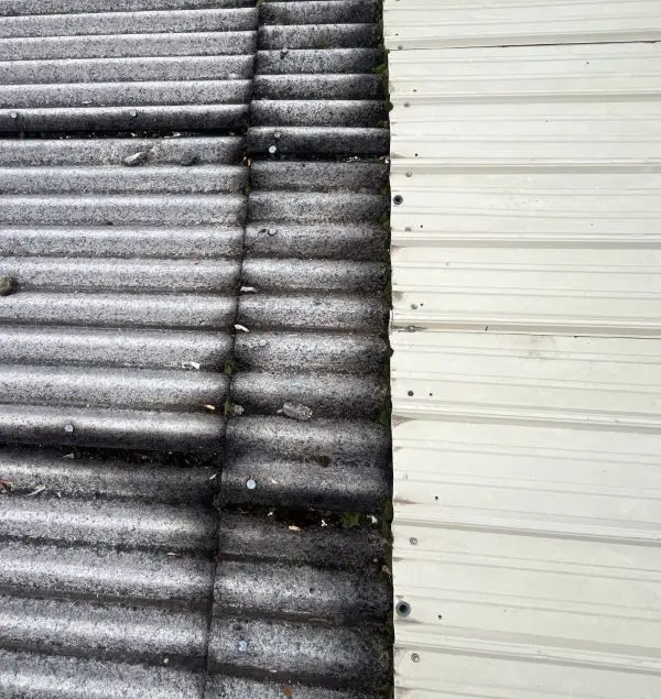 Transite roof panels with metal overlay